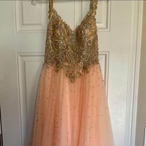 Homecoming/prom dress. It’s a soft peachy pink color the skirt part and the top.